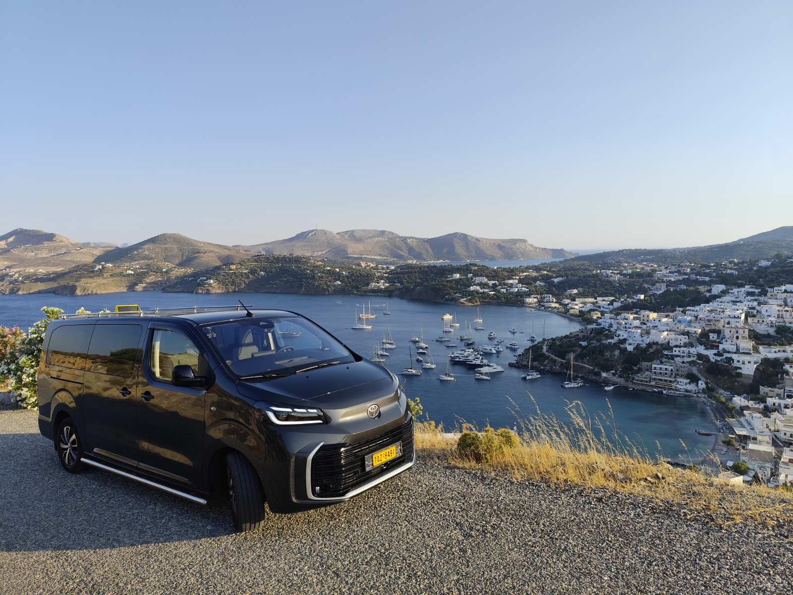 Michalis's taxi van overlooking the coast and villages of Leros